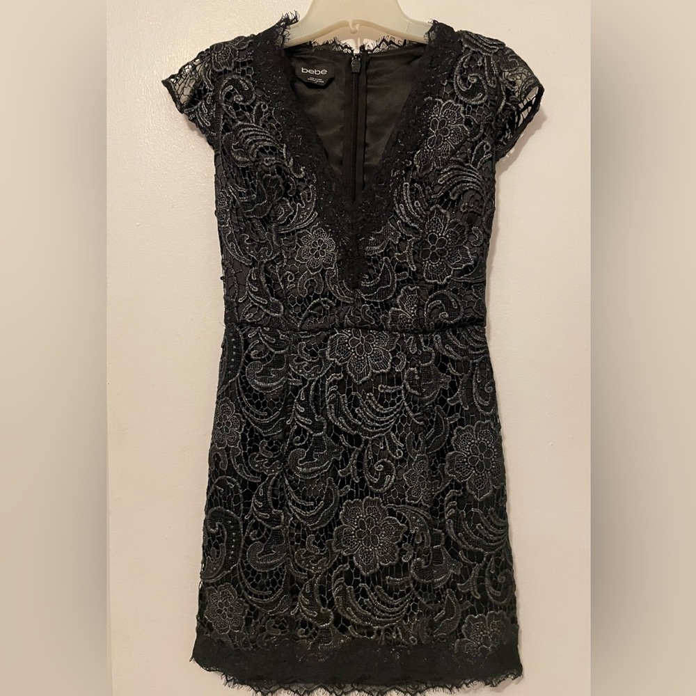 Beautiful black mini dress with a shimmery lace overlay.